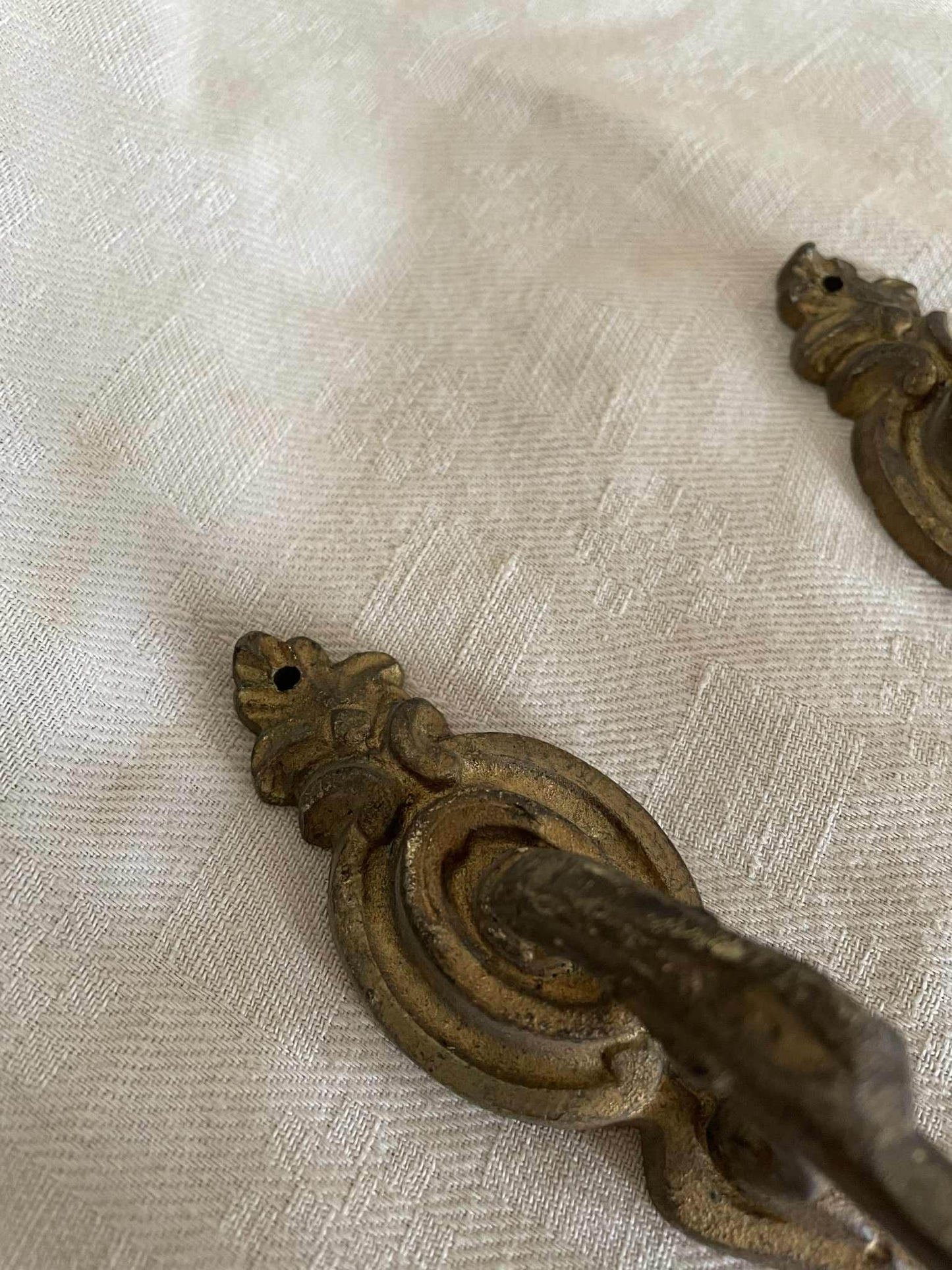 A pair of French gilded bronze curtain tie back/ wall hooks