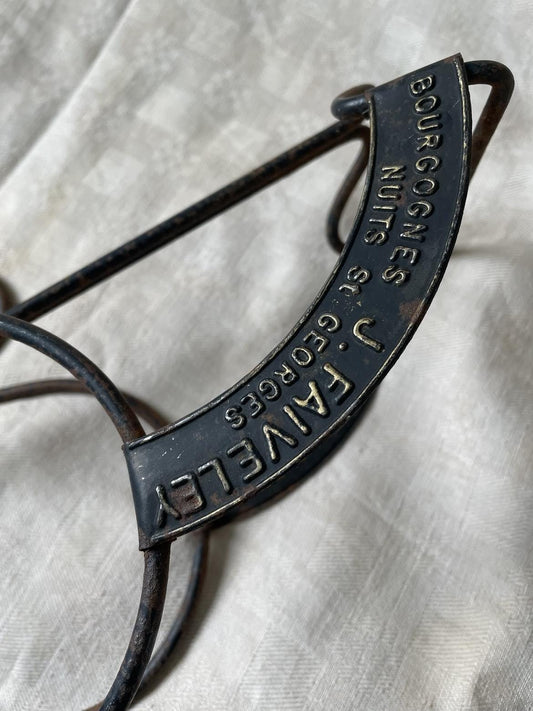 Vintage publicity bottle rest for Bourgognes (Burgundy wine) produced by Faiveley