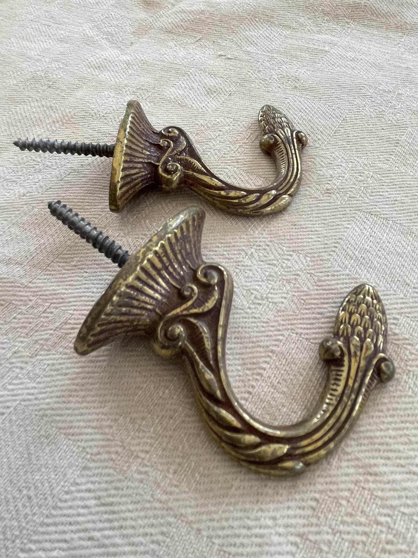 A pair of  Brass hooks for curtain tie backs