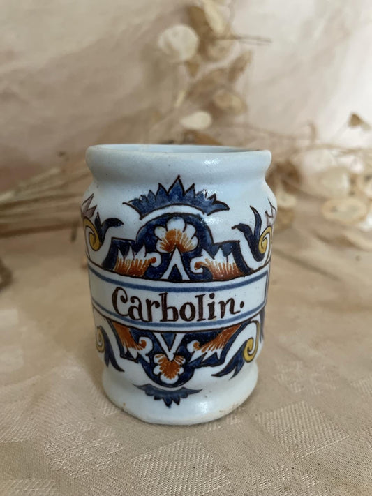 Polychrome earthenware apothecary jar marked  "Carbolin"