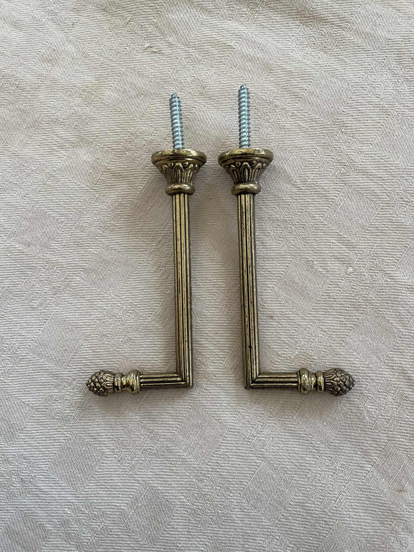 A Pair of brass curtain tie back hooks. - 10cm