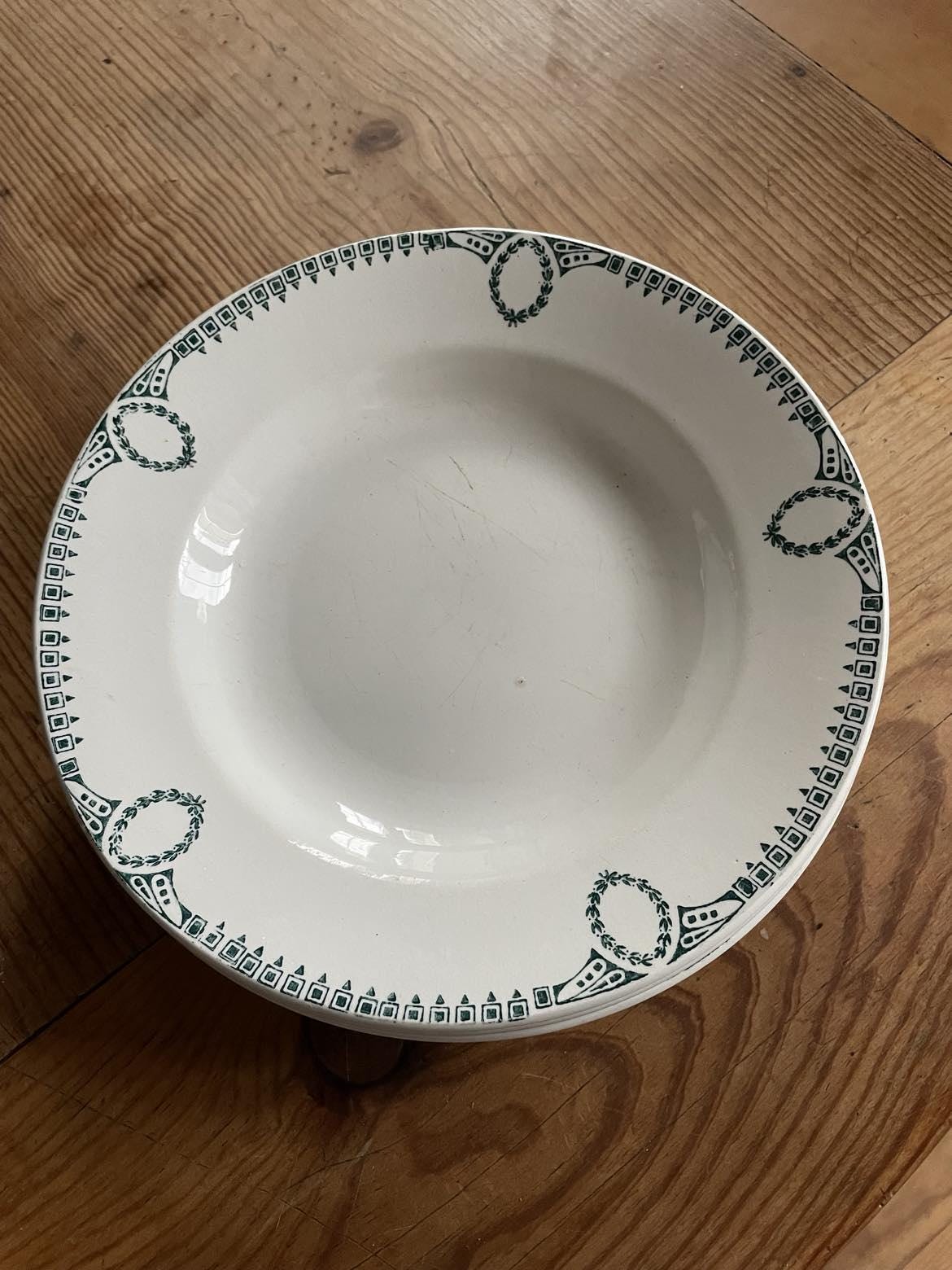 A set of 4 shallow bowls by St Amand Céranord