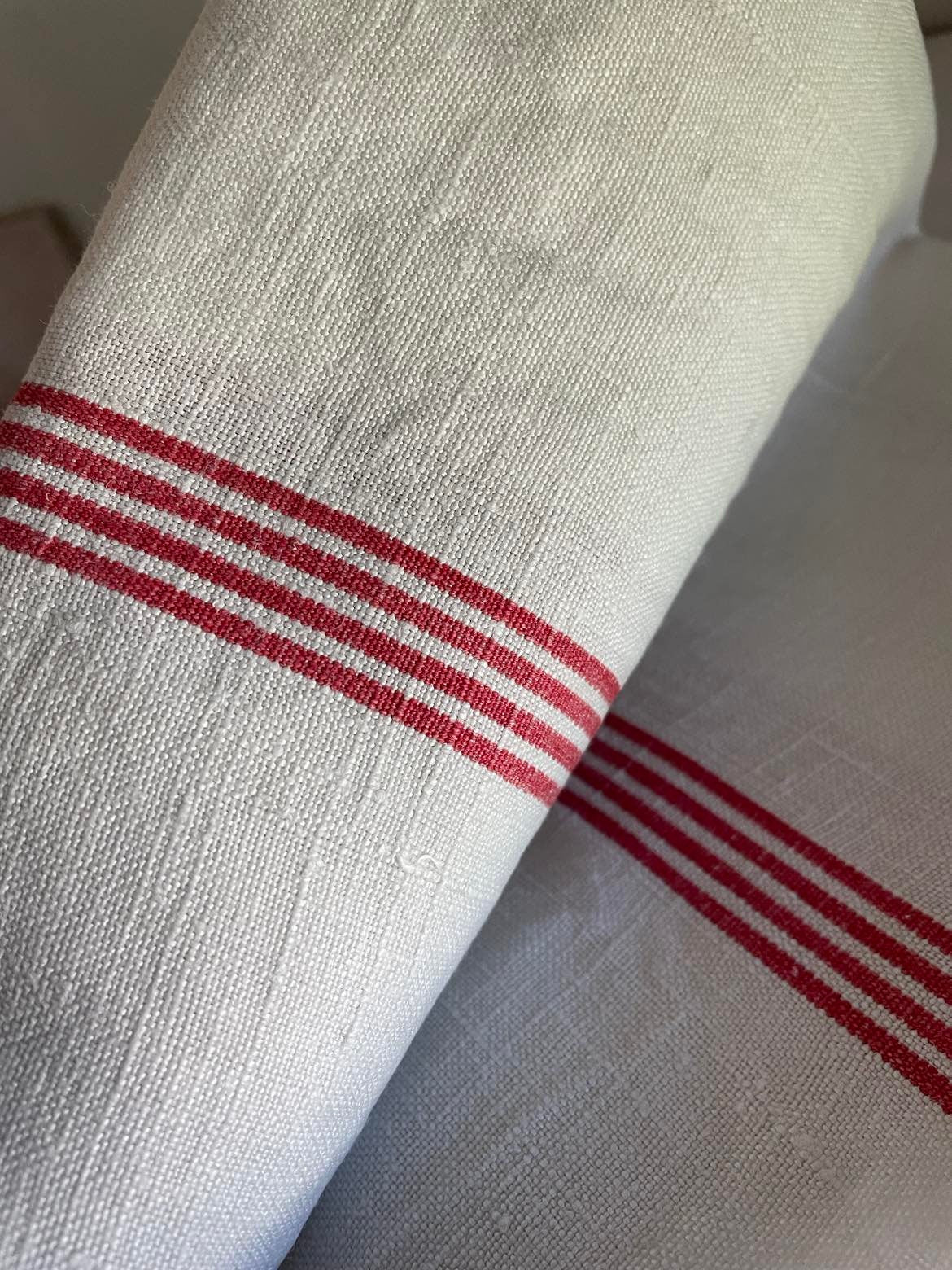 A single large red stripe Metis ( linen/cotton mix) tea towel