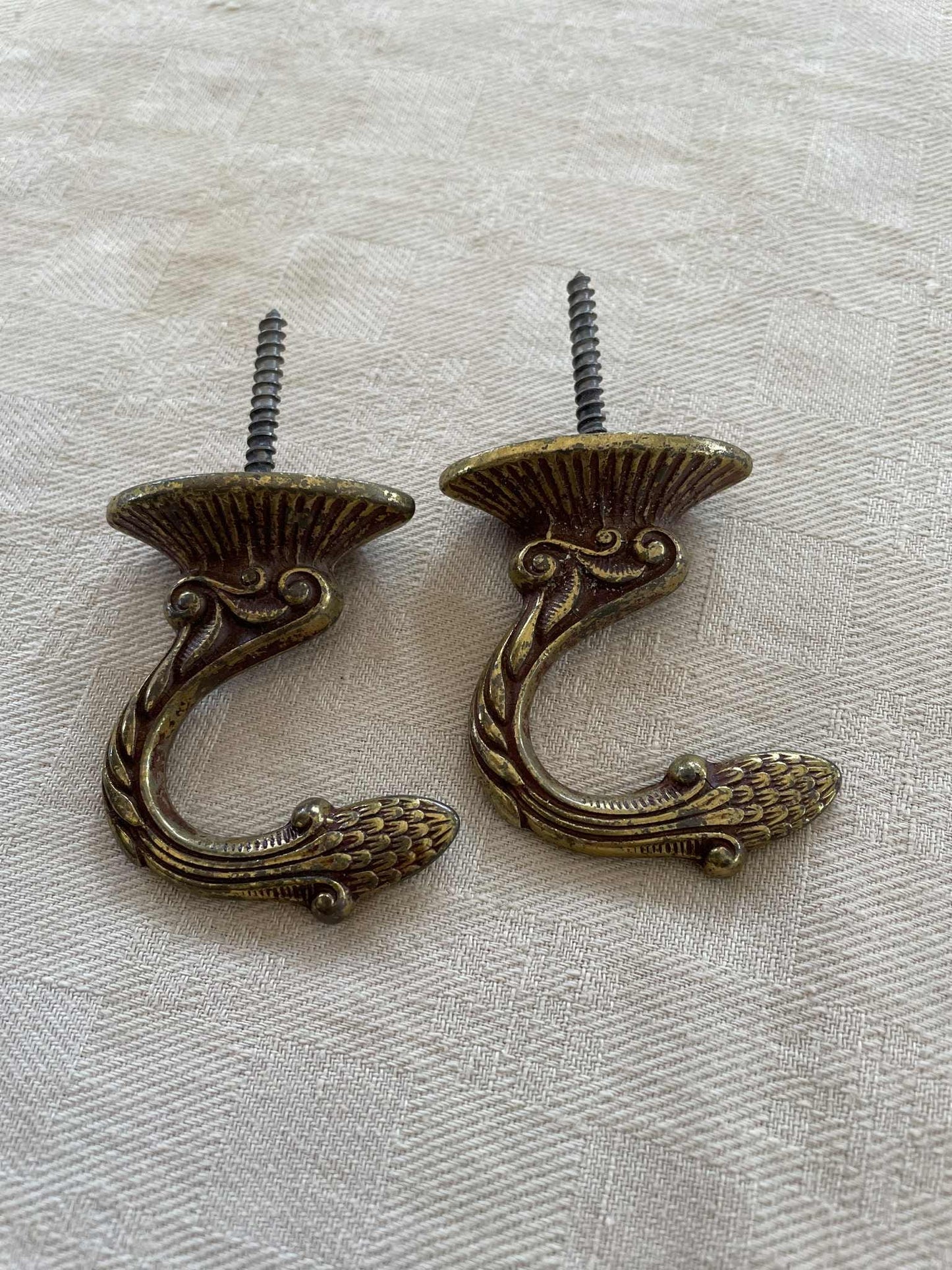 A pair of  Brass hooks for curtain tie backs