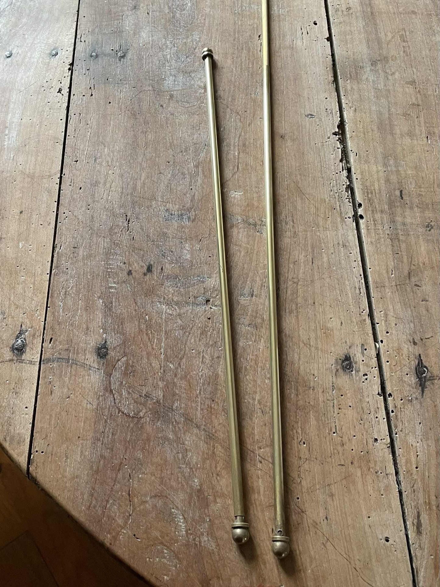 Two extendable brass lightweight curtain rods 39cm to 73cm max 6mm diameter
