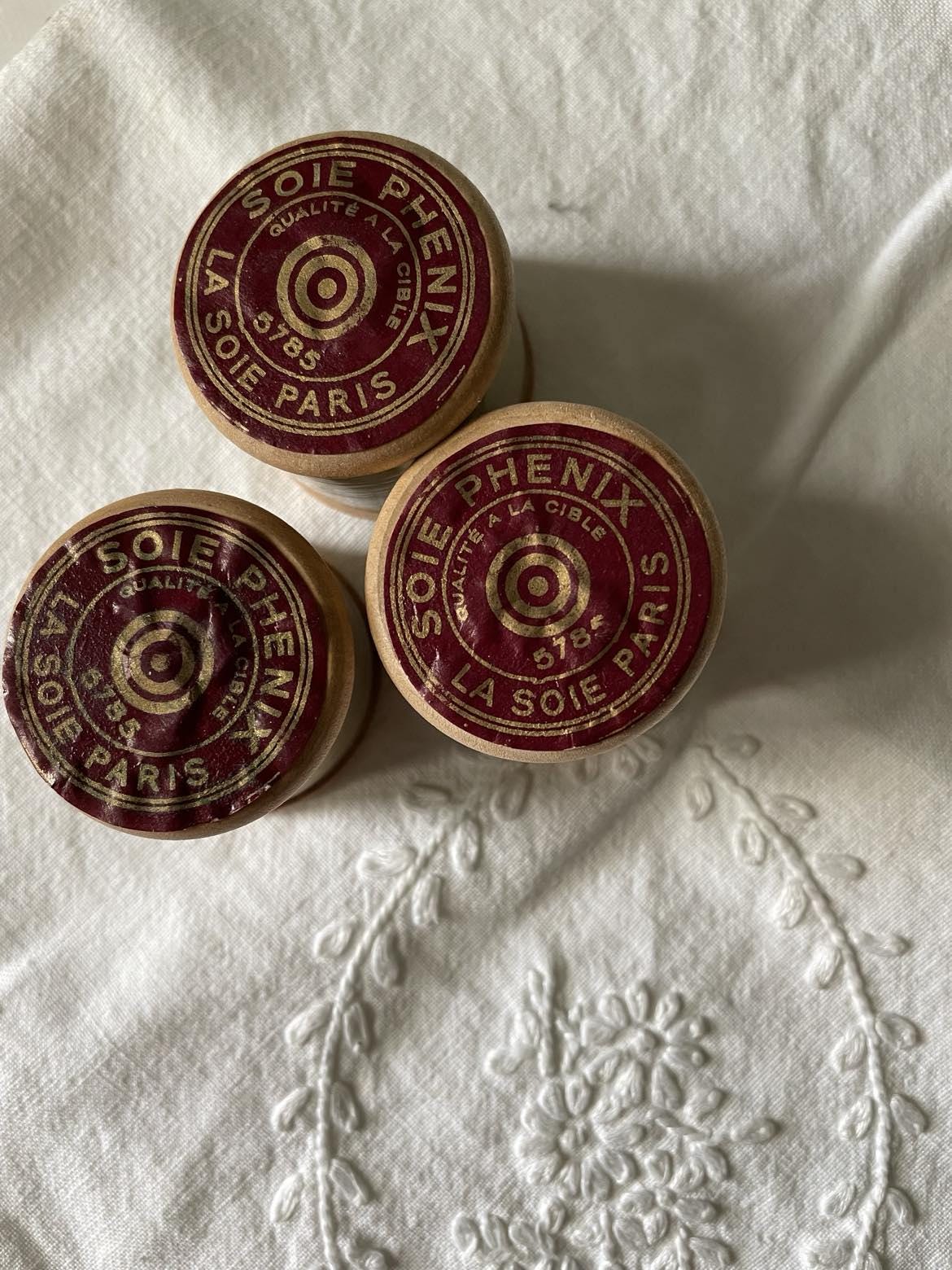 3 Vintage wooden spools of silk thread