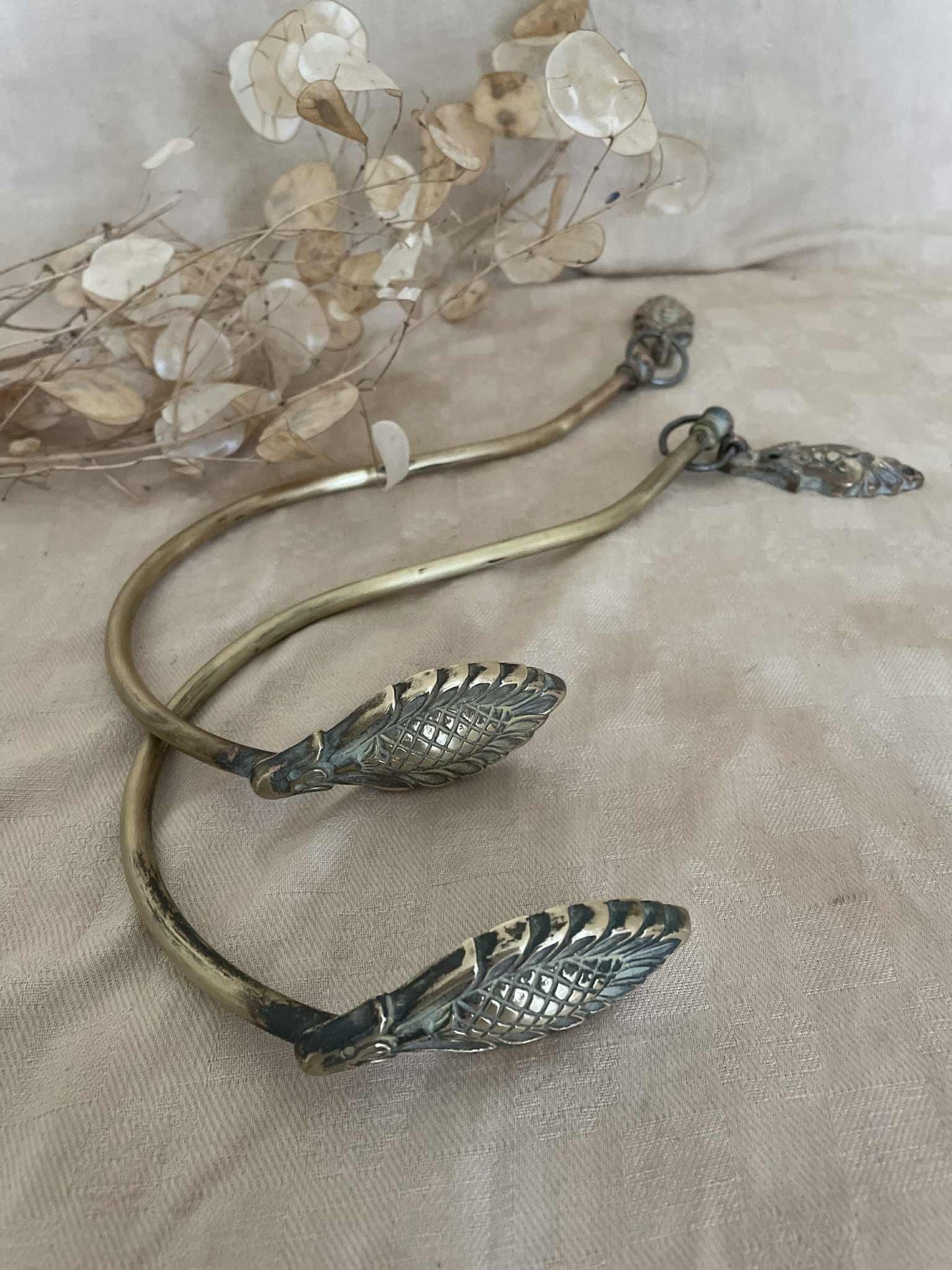 One pair of brass suspended swan neck curtain tie backs / embrasse rideau