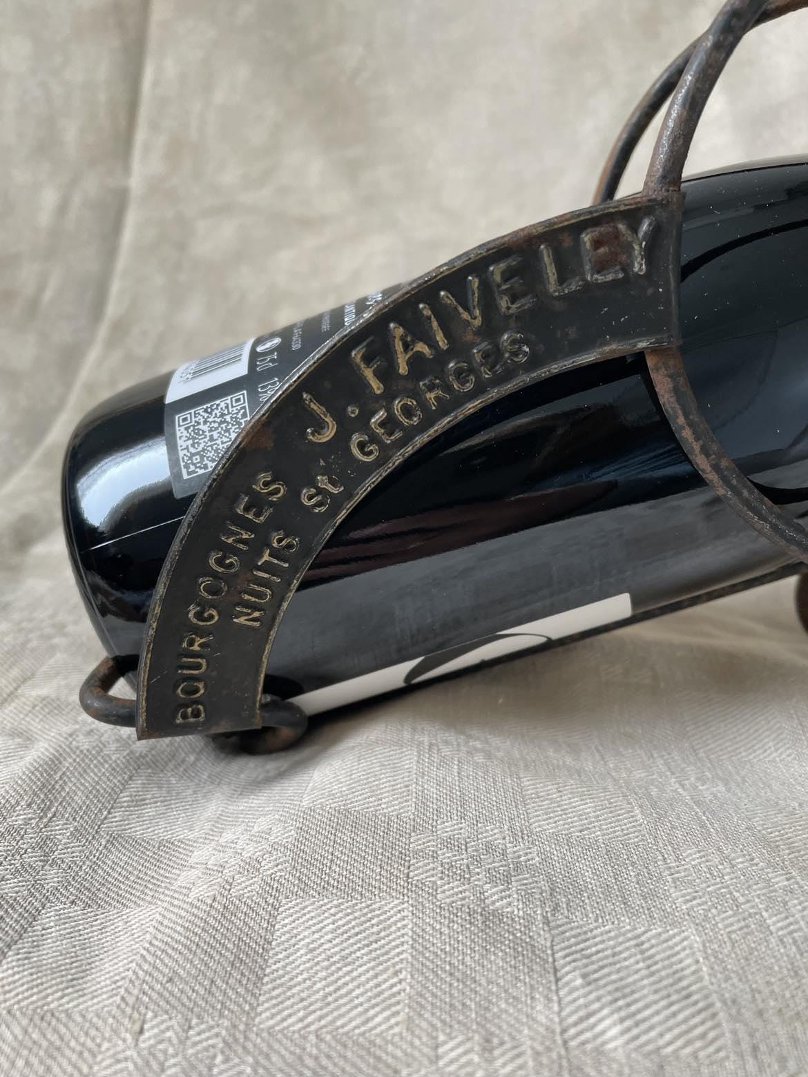 Vintage publicity bottle rest for Bourgognes (Burgundy wine) produced by Faiveley