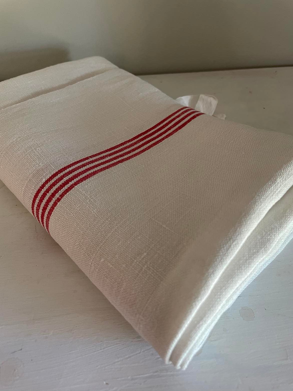 A single large red stripe Metis ( linen/cotton mix) tea towel