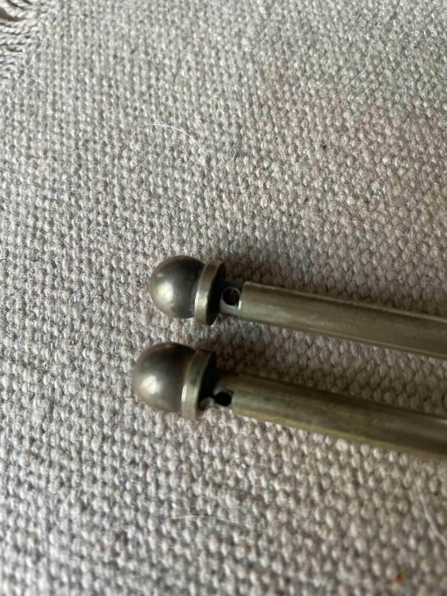 Two extendable brass lightweight curtain rods 39cm to 73cm max 6mm diameter