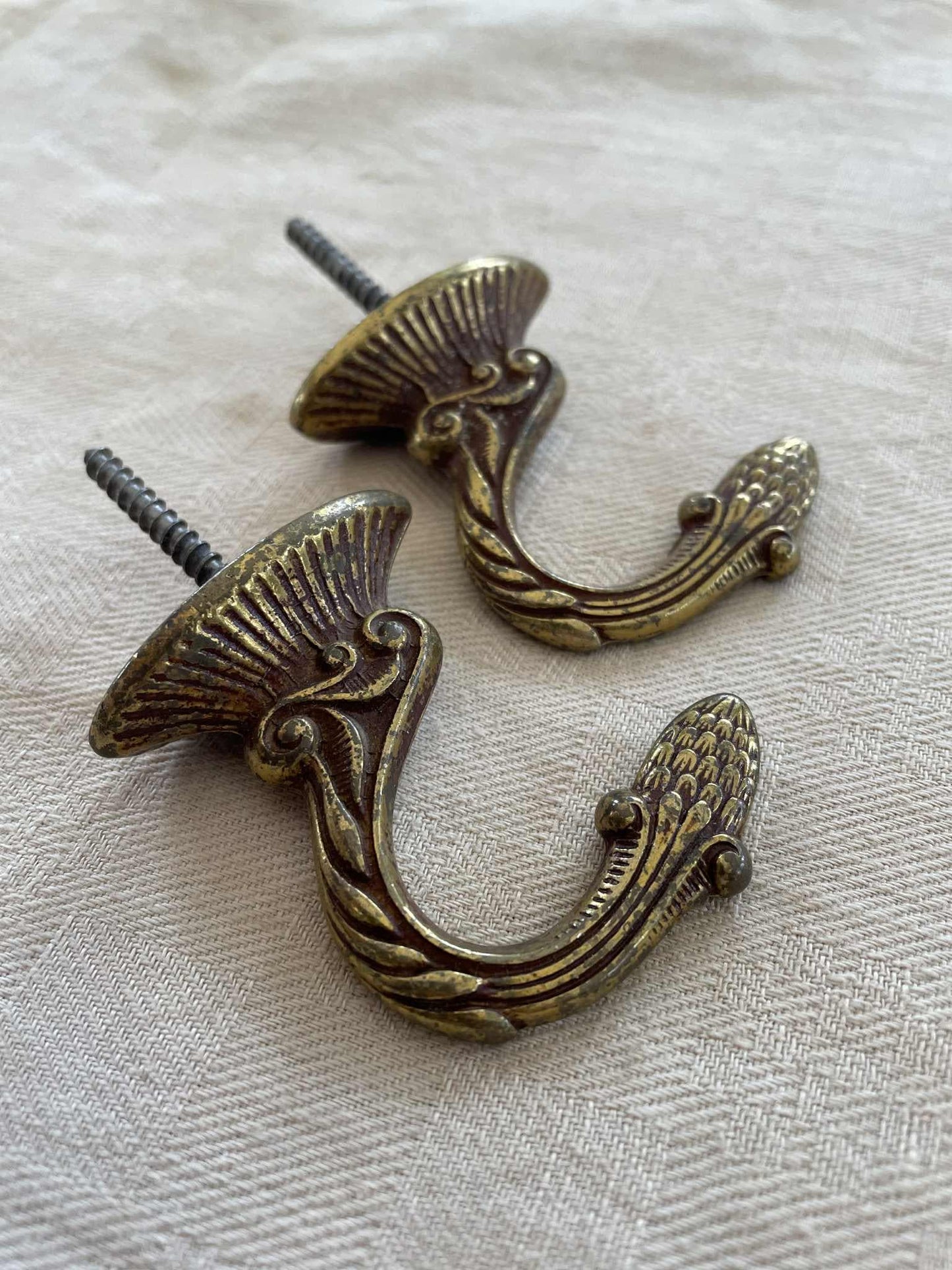 A pair of  Brass hooks for curtain tie backs