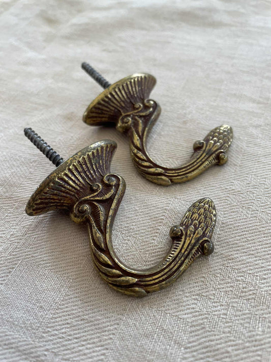 A pair of  Brass hooks for curtain tie backs