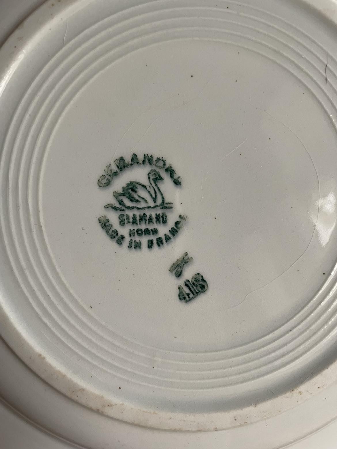 A set of 4 shallow bowls by St Amand Céranord