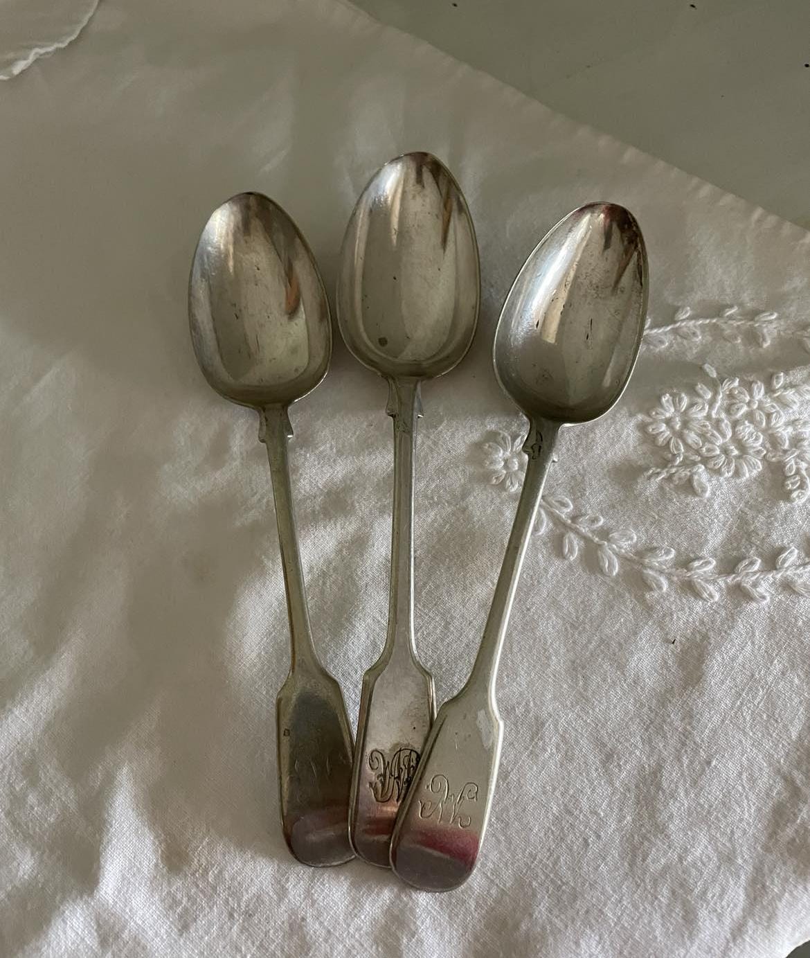 A set of 3 Monogrammed Silver plated spoons