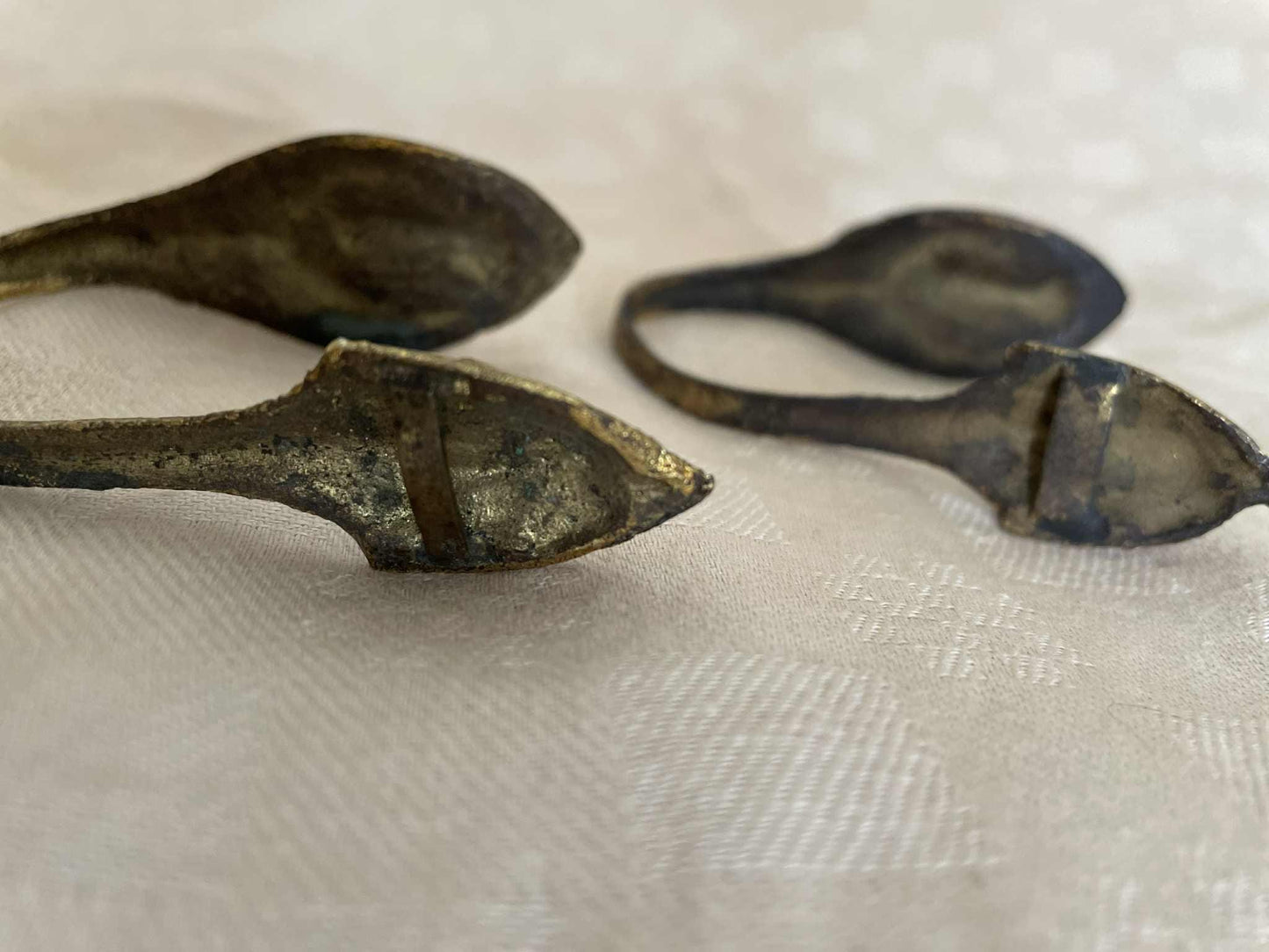 A pair of gilded brass curtain tie back hooks