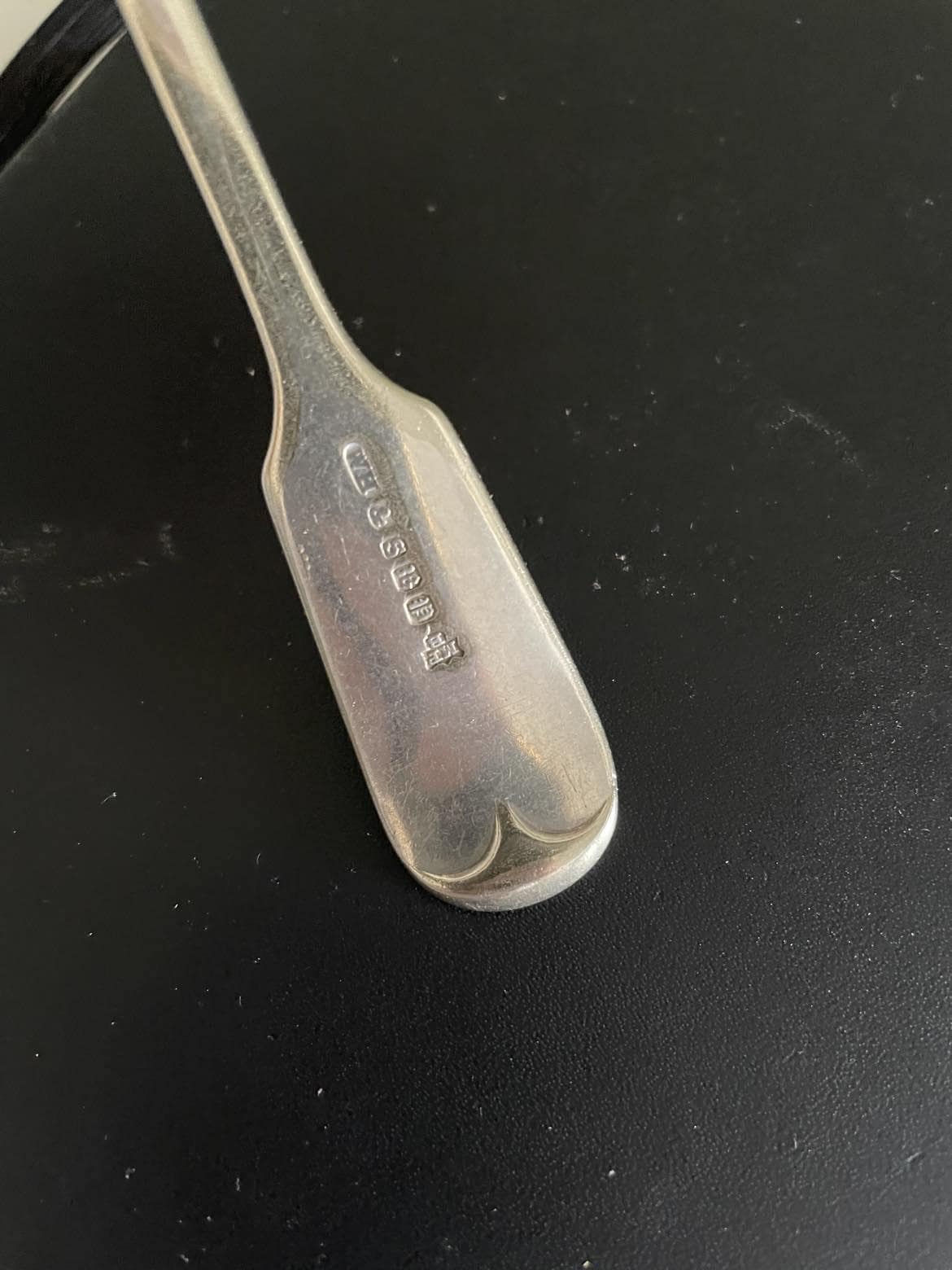 A set of 3 Monogrammed Silver plated spoons