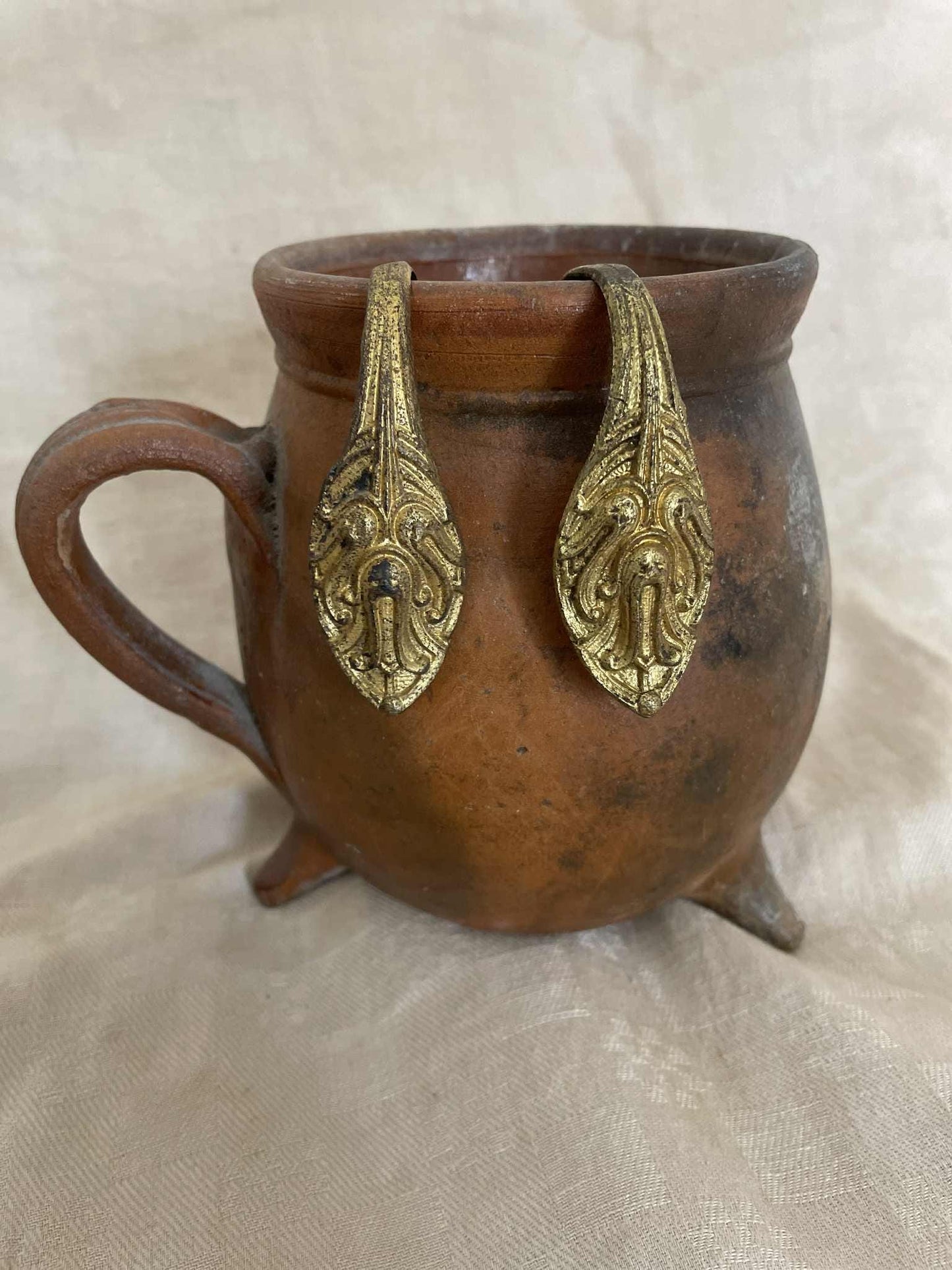 A pair of gilded brass curtain tie back hooks