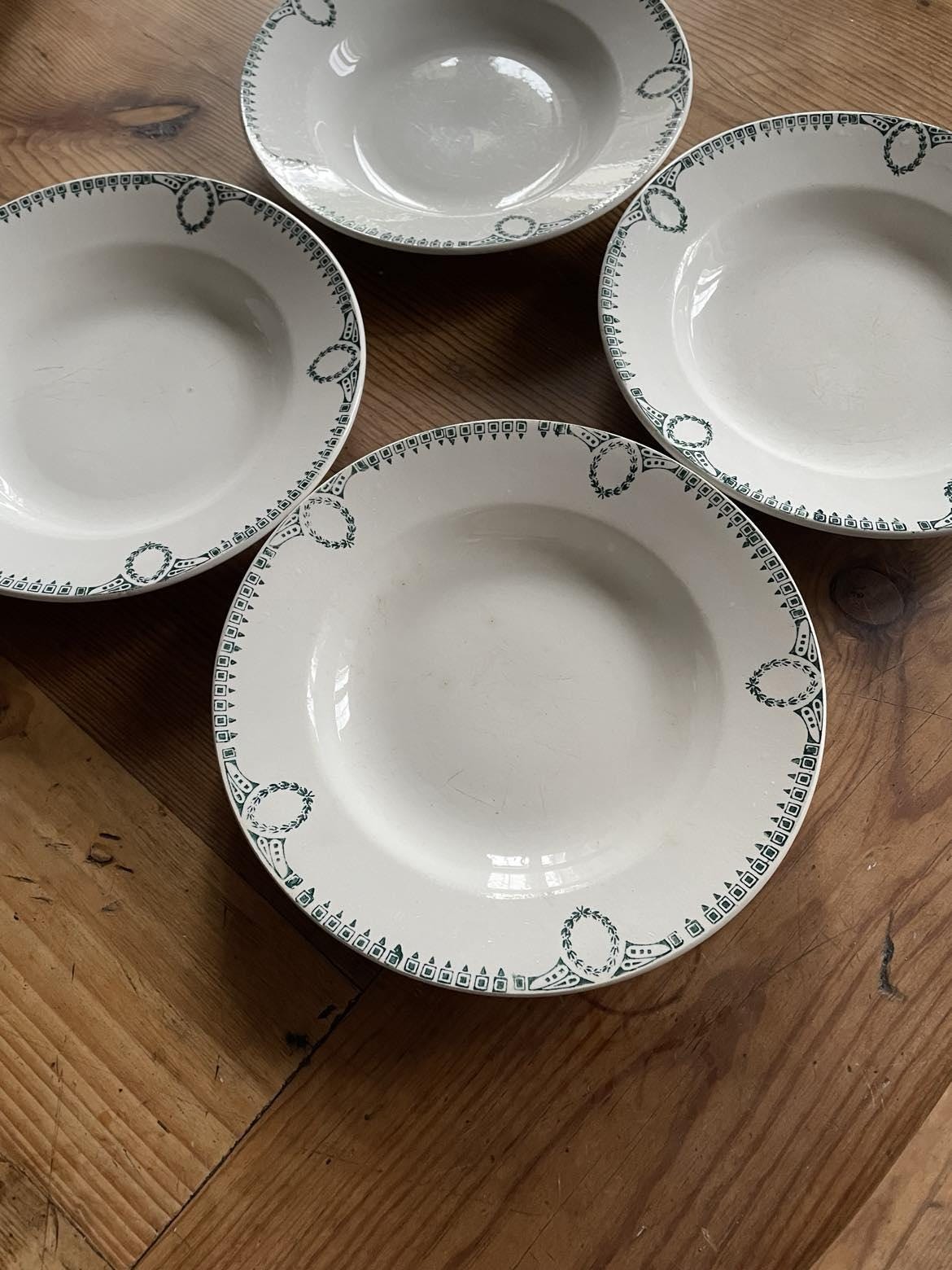 A set of 4 shallow bowls by St Amand Céranord