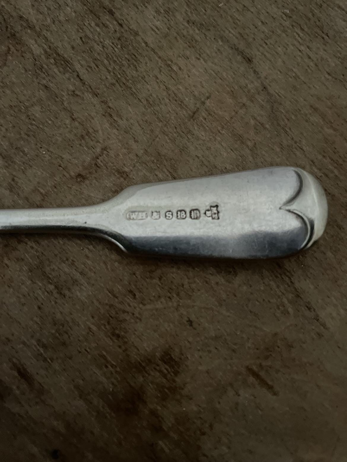 A set of 3 Monogrammed Silver plated spoons